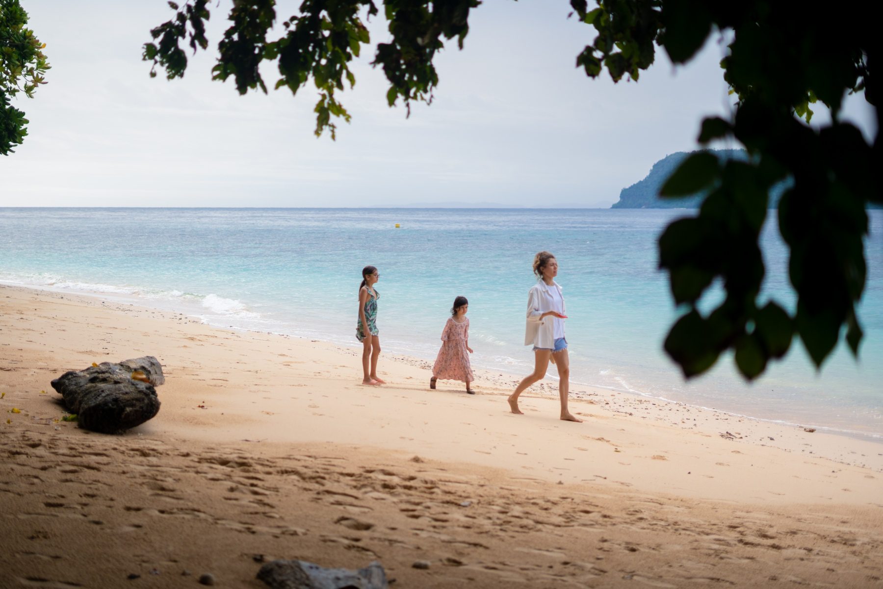 Kids playing on the Murex Bangka white sand beach