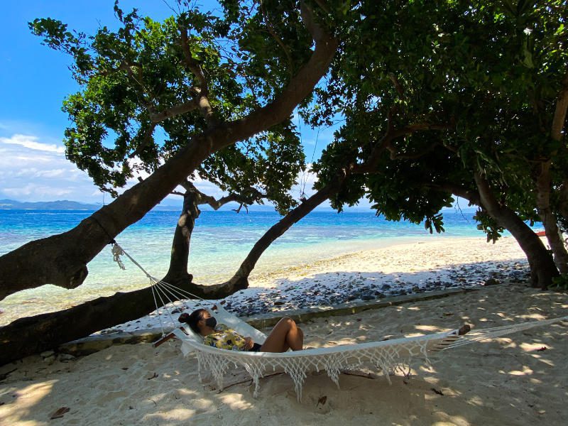 sleeping on the hammock by the beach