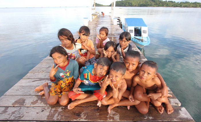 Children on the jetty in Lihunu Village, North Sulawesi