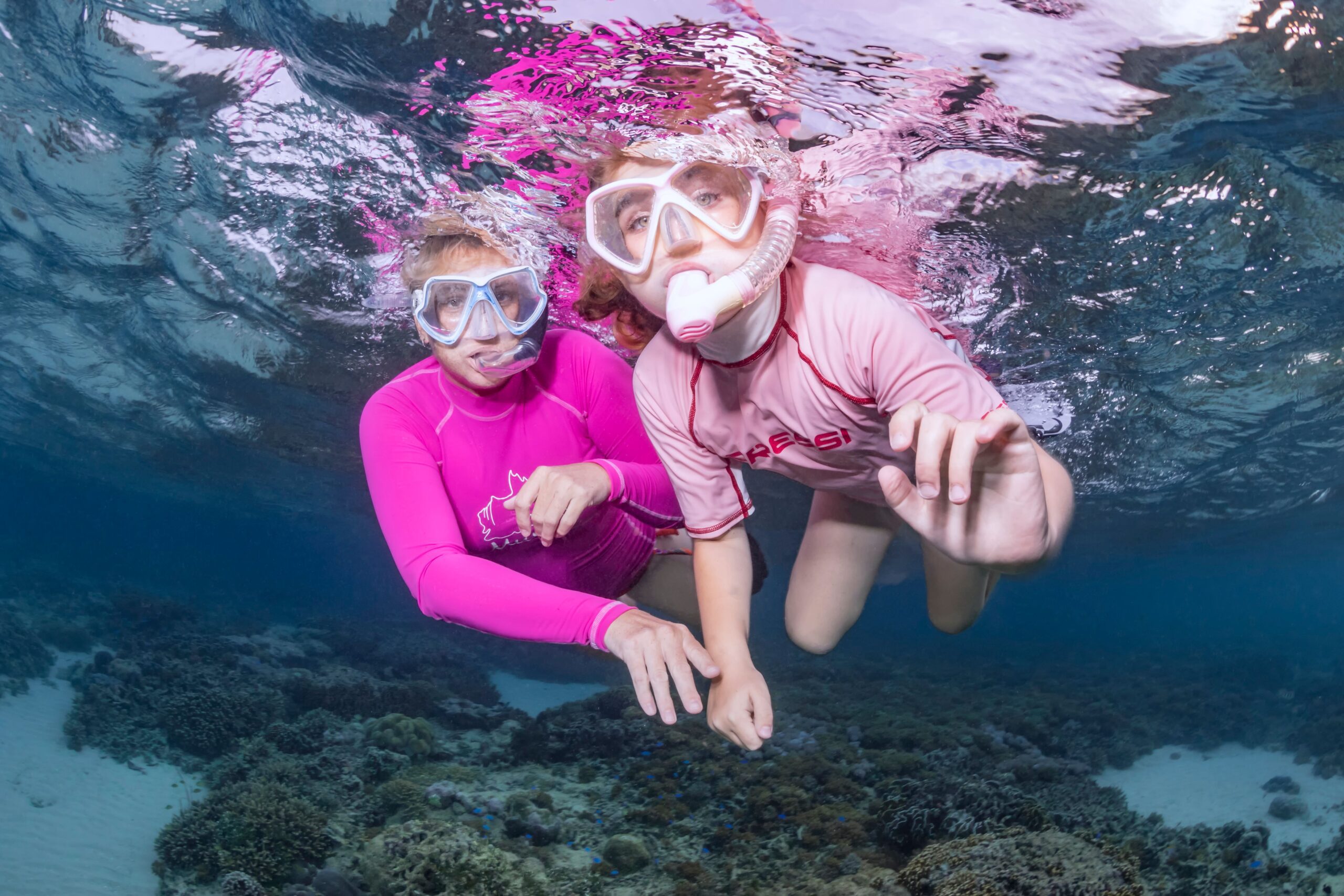 Mom and kid snorkeling in North Sulawesi