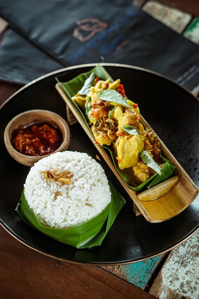 Ayam Isi Di Buluh, chicken dish cooked inside bamboo tubes